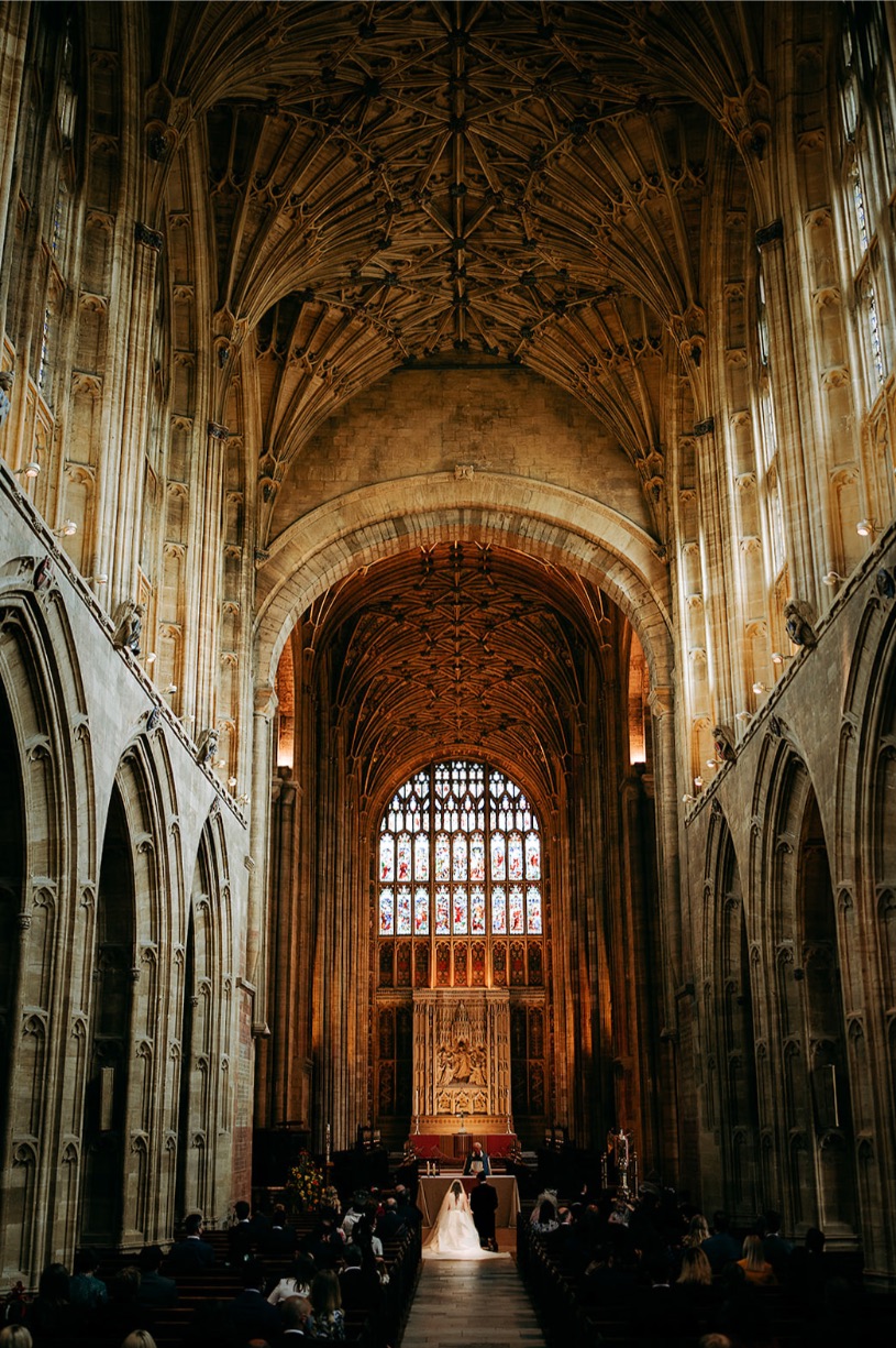 Bride and groom at the end of the asile at Bath abbey in the city of Bath