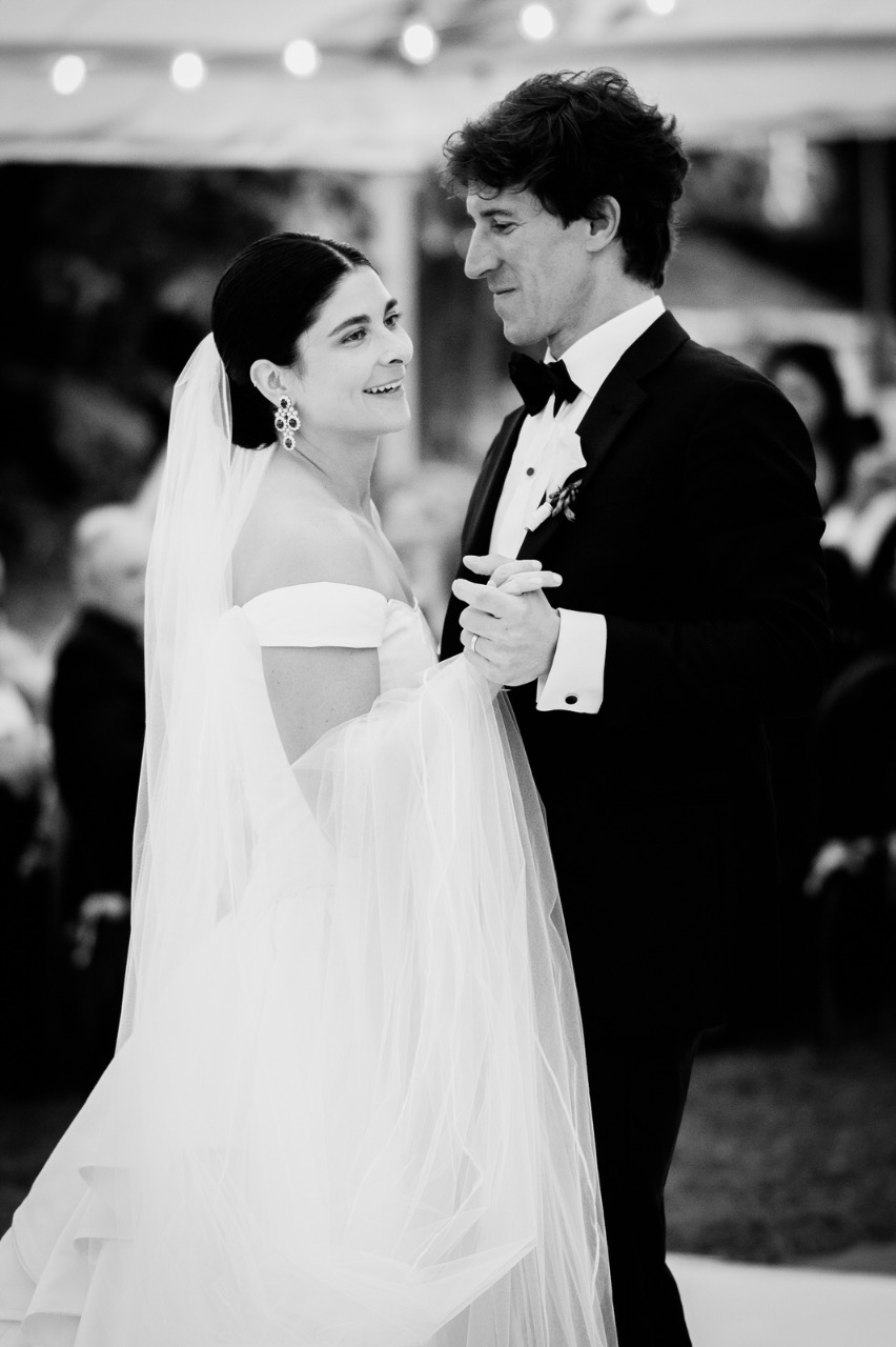 Bride and grrom having thier first dance in black and white at babbighton house in somerset.