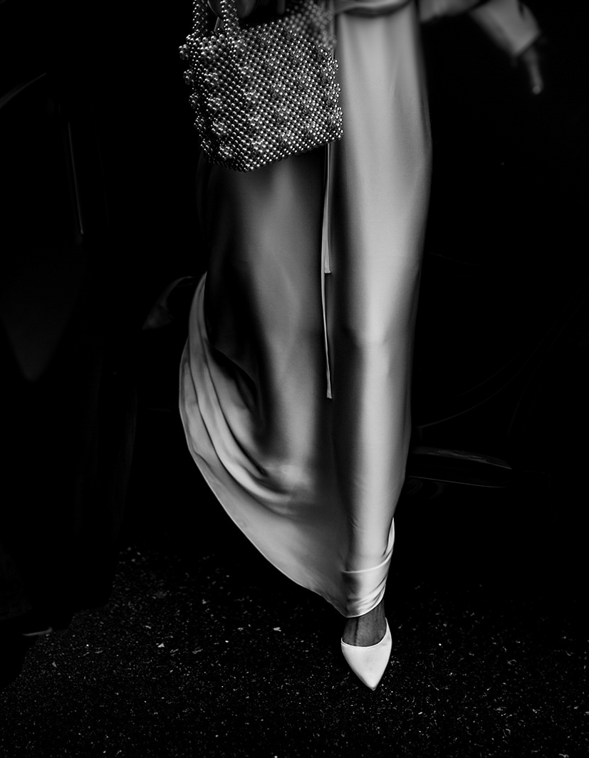 black and white picture of brides shoes getting out of the car at babbighton house in somerset