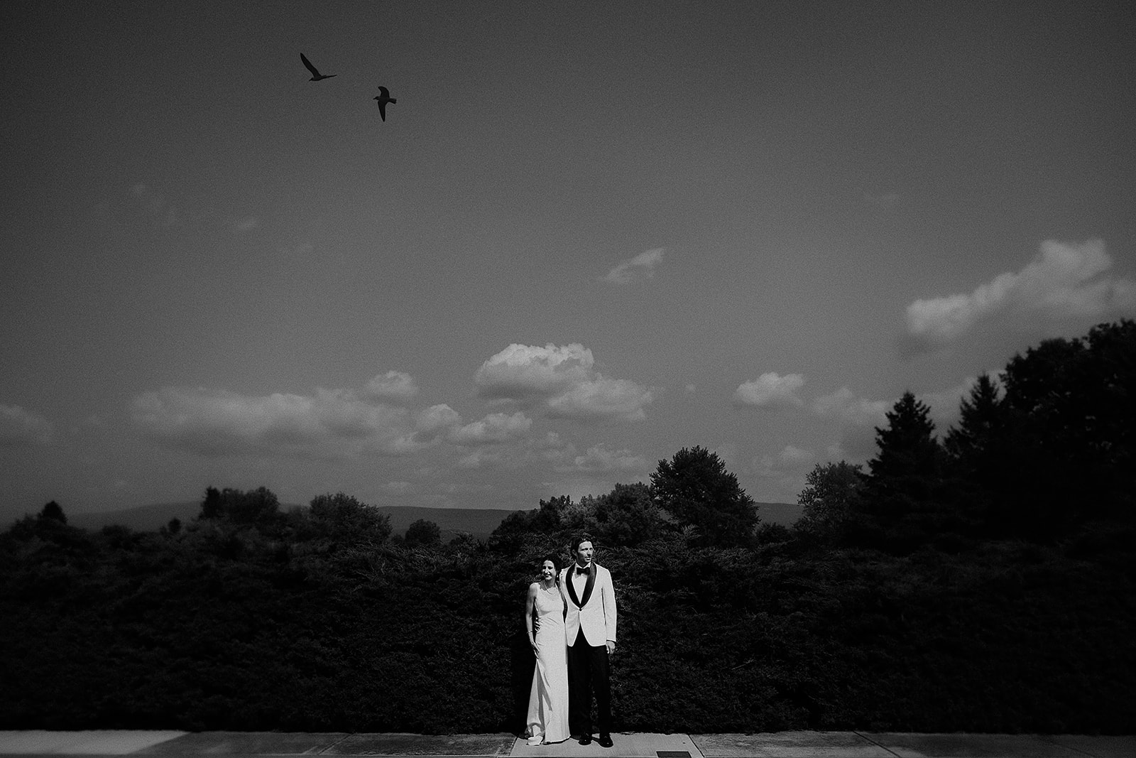 bride and groom poolside in black and white at 1768 Hubbell Homestead at Colgate Park