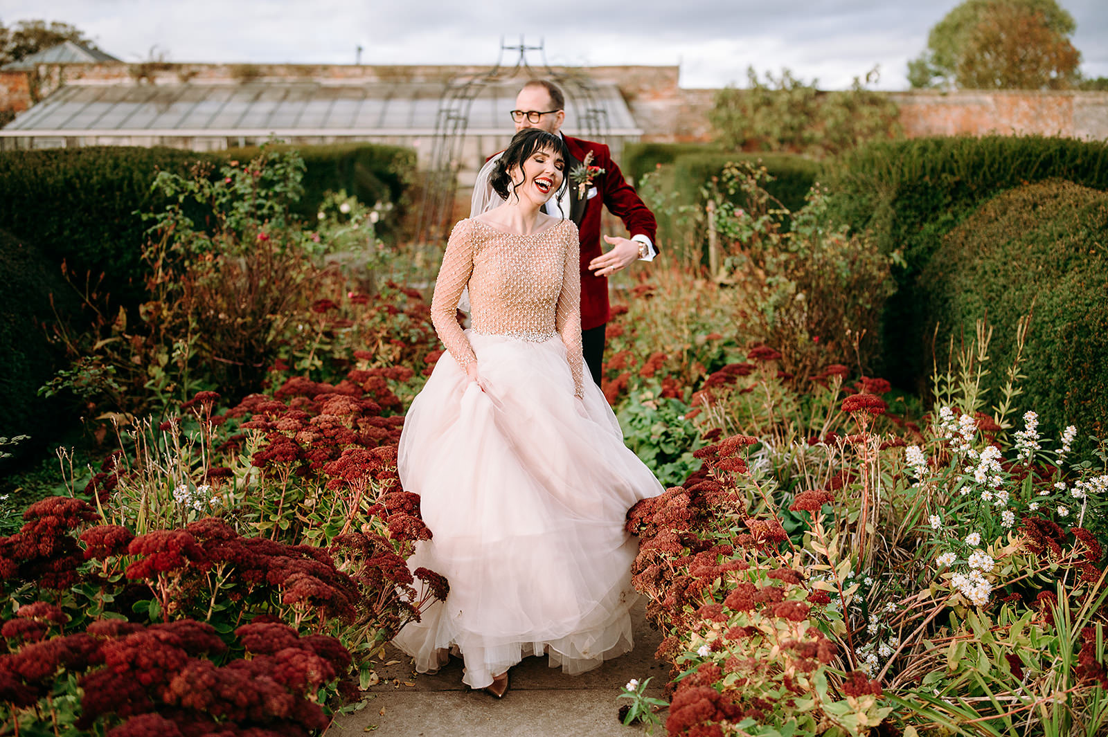 Bride and groom running at their fall wedding north cadbury court in Somerset