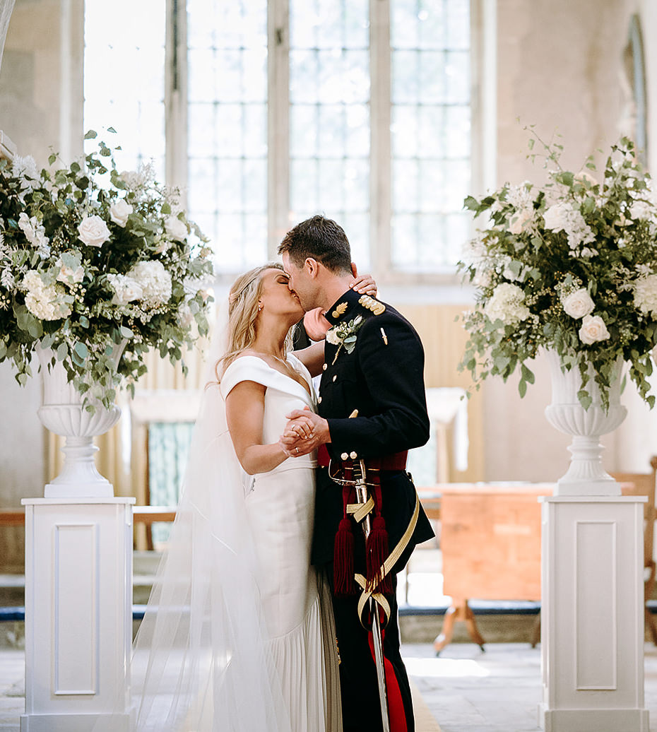 Bride and groom sharing their first kiss at syrencot Wiltshire